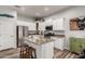 Bright kitchen featuring stainless steel appliances, granite counters, and a center island at 17751 W Desert View Ln, Goodyear, AZ 85338