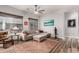 Comfortable living room with large windows, neutral color scheme, stylish rug, and contemporary decor at 17751 W Desert View Ln, Goodyear, AZ 85338