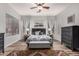 Relaxing main bedroom features a ceiling fan, neutral paint, and generous natural light at 17751 W Desert View Ln, Goodyear, AZ 85338