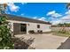 Spacious backyard featuring a concrete patio, modern seating area, green grass, and a charming swing set at 1841 E Clarendon Ave, Phoenix, AZ 85016