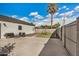 Large backyard with sleek patio furniture and a modern swing set area, creating a perfect outdoor space at 1841 E Clarendon Ave, Phoenix, AZ 85016