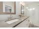 Modern bathroom with dual sinks, subway tile, a glass shower, and stylish black-and-white flooring at 1841 E Clarendon Ave, Phoenix, AZ 85016