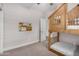 Cozy bedroom featuring a unique wooden bunk bed with playful house-shaped frame, creating a charming ' space at 1841 E Clarendon Ave, Phoenix, AZ 85016