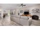 Bright and airy living room featuring wood floors, comfortable seating, and a modern ceiling fan at 1841 E Clarendon Ave, Phoenix, AZ 85016