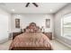 Elegant bedroom with ornate headboard, matching nightstands, and soft lighting at 18938 W Luke Ave, Litchfield Park, AZ 85340