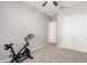 Bedroom with carpet flooring, ceiling fan, and walk-in closet provides comfort and storage at 18938 W Luke Ave, Litchfield Park, AZ 85340