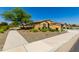 Charming home on a corner lot with mature landscaping and a convenient sidewalk at 18938 W Luke Ave, Litchfield Park, AZ 85340