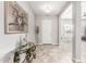 Elegant foyer with decorative console table and artwork, leading to the living areas at 18938 W Luke Ave, Litchfield Park, AZ 85340