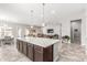 Spacious kitchen island with modern finishes, overlooking the living areas at 18938 W Luke Ave, Litchfield Park, AZ 85340