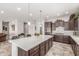 Bright, modern kitchen with a large center island at 18938 W Luke Ave, Litchfield Park, AZ 85340