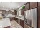 Modern kitchen featuring stainless steel appliances and quartz countertops at 18938 W Luke Ave, Litchfield Park, AZ 85340