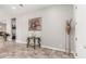 Bright living area featuring a decorative console table and ample space for relaxation at 18938 W Luke Ave, Litchfield Park, AZ 85340