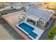 Aerial view of a private backyard featuring a modern pool, covered patio, and desert landscaping at 21397 S 215Th Way, Queen Creek, AZ 85142