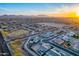 Wide aerial view of a vibrant community showcasing tree-lined streets and desert landscapes at 21397 S 215Th Way, Queen Creek, AZ 85142