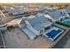 Aerial view of a single-Gathering home featuring a private backyard oasis with a sparkling pool and ample patio space at 21397 S 215Th Way, Queen Creek, AZ 85142