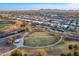 Aerial view of a community park surrounded by tree-lined streets and residential homes at 21397 S 215Th Way, Queen Creek, AZ 85142