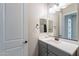 Bright bathroom featuring a modern vanity, mirror, and fixtures, offering a clean and welcoming space at 21397 S 215Th Way, Queen Creek, AZ 85142