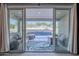 View from the home's interior, looking out onto the covered patio and refreshing pool area at 21397 S 215Th Way, Queen Creek, AZ 85142