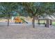 Neighborhood playground featuring mature trees, a picnic pavilion, and colorful play equipment at 21397 S 215Th Way, Queen Creek, AZ 85142