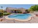 Backyard featuring a kidney shaped pool, desert landscaping and covered patio at 2142 E Wildhorse Dr, Chandler, AZ 85286