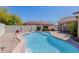 Inviting backyard pool with clean, clear water surrounded by patio space and desert landscaping at 2142 E Wildhorse Dr, Chandler, AZ 85286