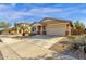 Charming single-story home with a two-car garage and low-maintenance desert landscaping at 21609 N Diamond Dr, Maricopa, AZ 85138