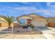 Charming single-story home with desert landscaping, a two-car garage, and a quaint front entrance at 21609 N Diamond Dr, Maricopa, AZ 85138