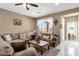 Inviting living room featuring plush seating, neutral tones, and a cozy atmosphere at 21609 N Diamond Dr, Maricopa, AZ 85138