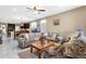 Spacious living room seamlessly connects to the kitchen and dining area, perfect for entertaining at 21609 N Diamond Dr, Maricopa, AZ 85138