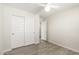 Bedroom featuring tile floors, a ceiling fan, and closet doors at 2204 W Minton St, Phoenix, AZ 85041