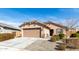 Inviting single-story home with a well-manicured front yard and convenient two-car garage at 2204 W Minton St, Phoenix, AZ 85041