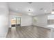 Bright living room featuring stylish floors, recessed lighting, and a sliding glass door to the backyard at 2204 W Minton St, Phoenix, AZ 85041