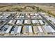 An aerial view showing a well-planned neighborhood with tree lined streets and sidewalks at 2263 N Trekell Rd # 113, Casa Grande, AZ 85122