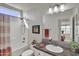 Well-lit bathroom featuring shower-tub combo and a single sink vanity with a large mirror at 2263 N Trekell Rd # 113, Casa Grande, AZ 85122