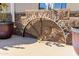 Entrance to Rancho Val Vista community featuring decorative landscaping and stone accents at 2263 N Trekell Rd # 113, Casa Grande, AZ 85122