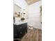 Chic powder room with a modern vanity, stylish mirror, and trendy decor, offering a sophisticated and functional space at 23420 S 202Nd St, Queen Creek, AZ 85142