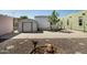 Large backyard area featuring a shed, concrete, and rock landscaping, offering a versatile outdoor space at 2528 E Mckellips Rd # 74, Mesa, AZ 85213