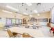 Versatile activity room, featuring tables, chairs, and a bulletin board for community engagement and learning at 2608 Leisure World --, Mesa, AZ 85206