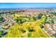 Stunning aerial view showcasing the golf course community, lush landscaping, and picturesque homes at 2608 Leisure World --, Mesa, AZ 85206