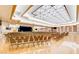 Spacious auditorium showcasing rows of chairs, stage, and striking geometric ceiling design at 2608 Leisure World --, Mesa, AZ 85206