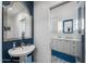 Charming bathroom with unique blue accents, stylish mirror, and updated fixtures at 2608 Leisure World --, Mesa, AZ 85206