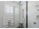 Beautiful bathroom featuring white tile, glass shower door, and tasteful design elements at 2608 Leisure World --, Mesa, AZ 85206