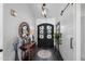 Stunning foyer with dark wood floors and black double doors at 2608 Leisure World --, Mesa, AZ 85206