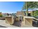 Outdoor kitchen featuring a built-in grill, bar seating, and ample counter space for entertaining guests at 2608 Leisure World --, Mesa, AZ 85206