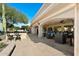 Expansive covered patio boasts comfortable seating, elegant lighting, and seamless indoor/outdoor living at 2608 Leisure World --, Mesa, AZ 85206