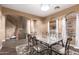 Cozy dining room with an elegant table and chairs, and view of stairway with wood floor at 2635 E Chester Dr, Chandler, AZ 85286