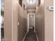 Hallway with wall cutouts and wood flooring, leading to other areas of the home at 2635 E Chester Dr, Chandler, AZ 85286