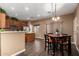 Well-appointed kitchen adjacent to a cozy dining area, featuring modern appliances and ample counter space at 2635 E Chester Dr, Chandler, AZ 85286