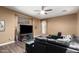 Living room with faux-wood flooring, neutral colored walls, and a ceiling fan at 2635 E Chester Dr, Chandler, AZ 85286