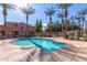 Community pool surrounded by palm trees and lush landscaping at 2635 E Chester Dr, Chandler, AZ 85286